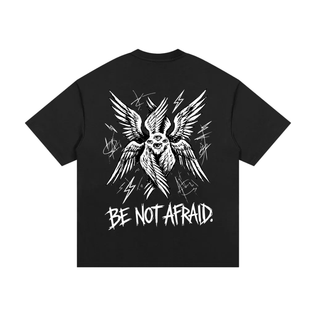 Black t-shirt with white graphic design and 'Be Not Afraid' text on a white background